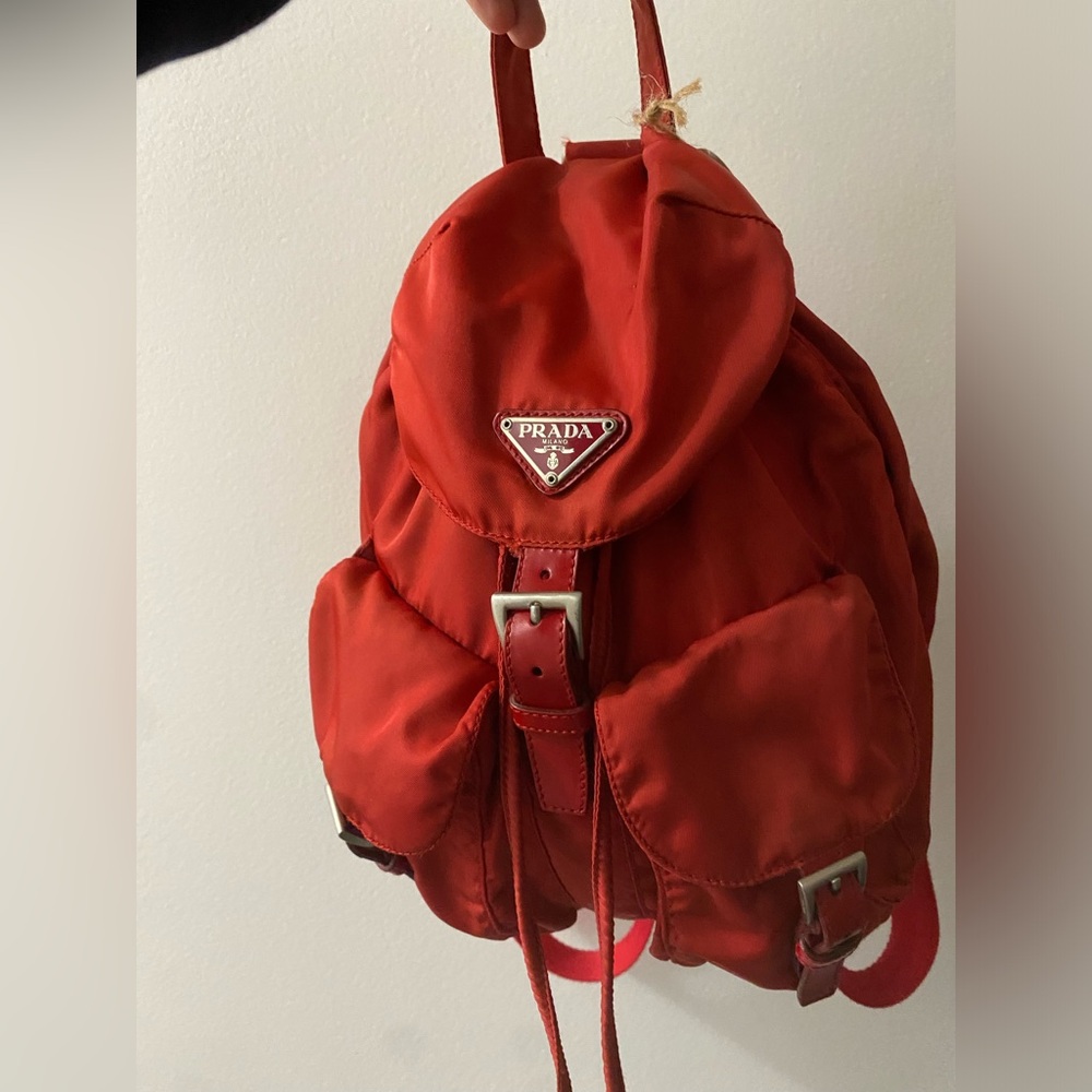 Prada red backpack❤️- a few faded areas the color is  red with some wear&tear